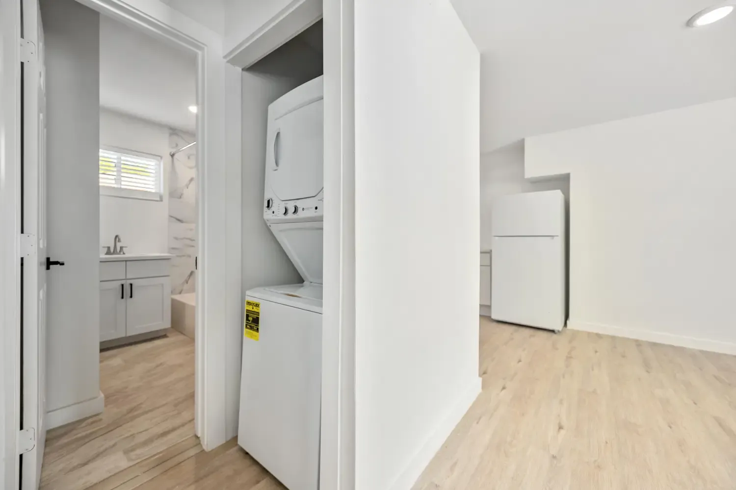 Stacked washer and dryer in the hallway closet